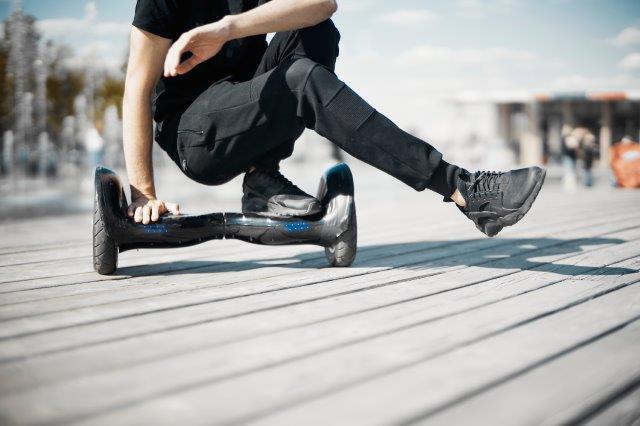 A person on a hoverboard. Scooter Advice 360