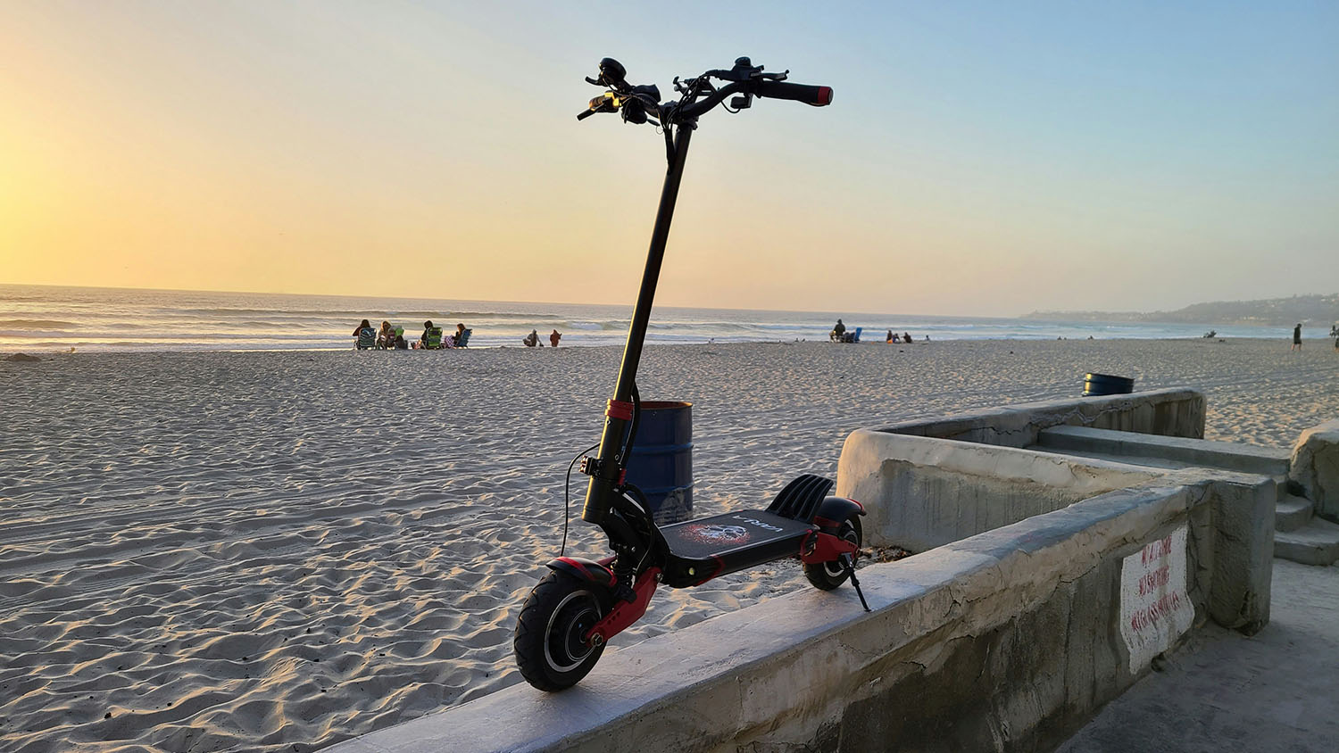 A lime scooter sitting on a wall at the beach, showcasing its impressive speed. Scooter Advice