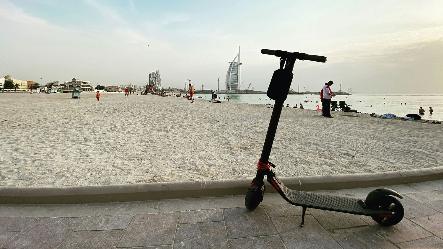 An electric scooter on a beach in Dubai. Scooter Advice