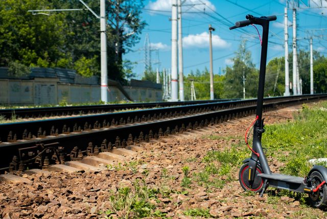 Xiaomi e-scooter on a train track. Are Electric Scooters Legal? Scooter Advice 360